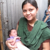 New mother in Dhaka slums. (Photo courtesy of Jhpiego.) New mother in Dhaka slums. (Photo courtesy of Jhpiego.)